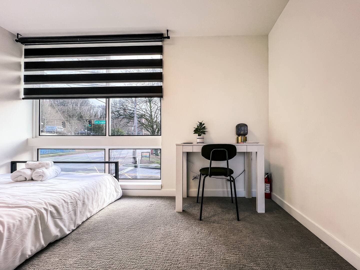 The Sunny Nest, a light-filled bedroom with a private bath and large window