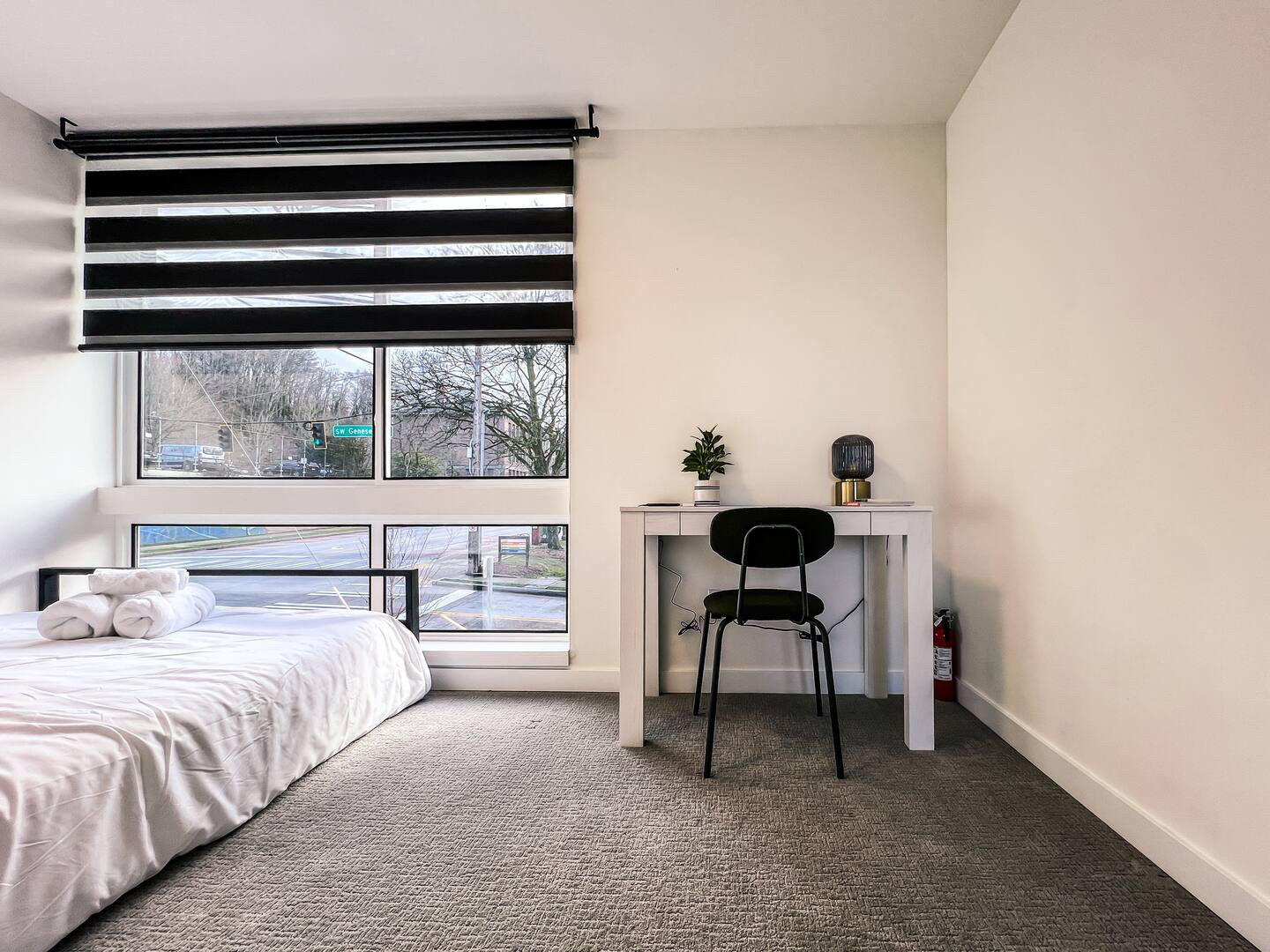 The Sunny Nest, a light-filled bedroom with a private bath and large window